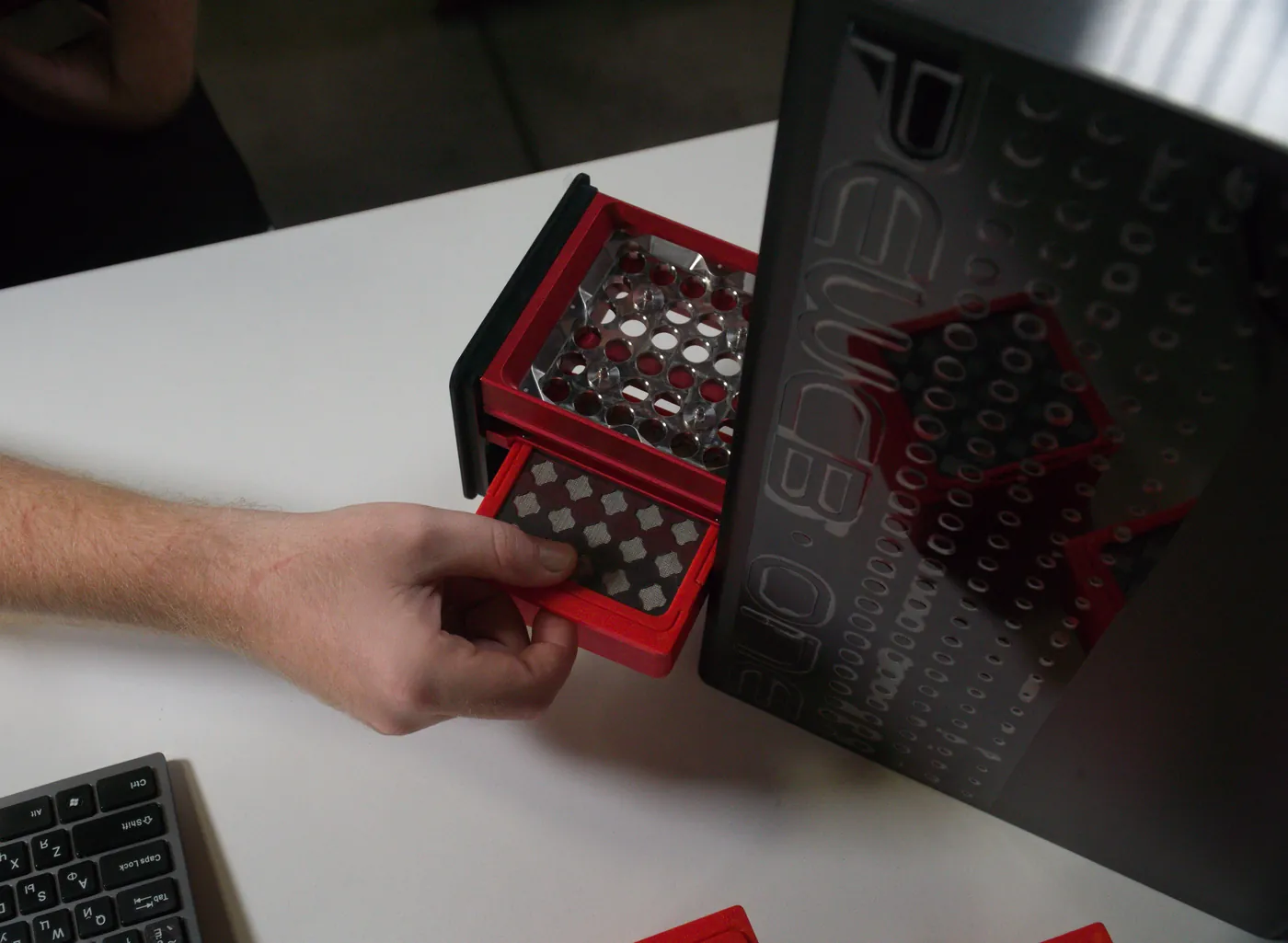 The built-in filter module sliding out of PewCB One for servicing