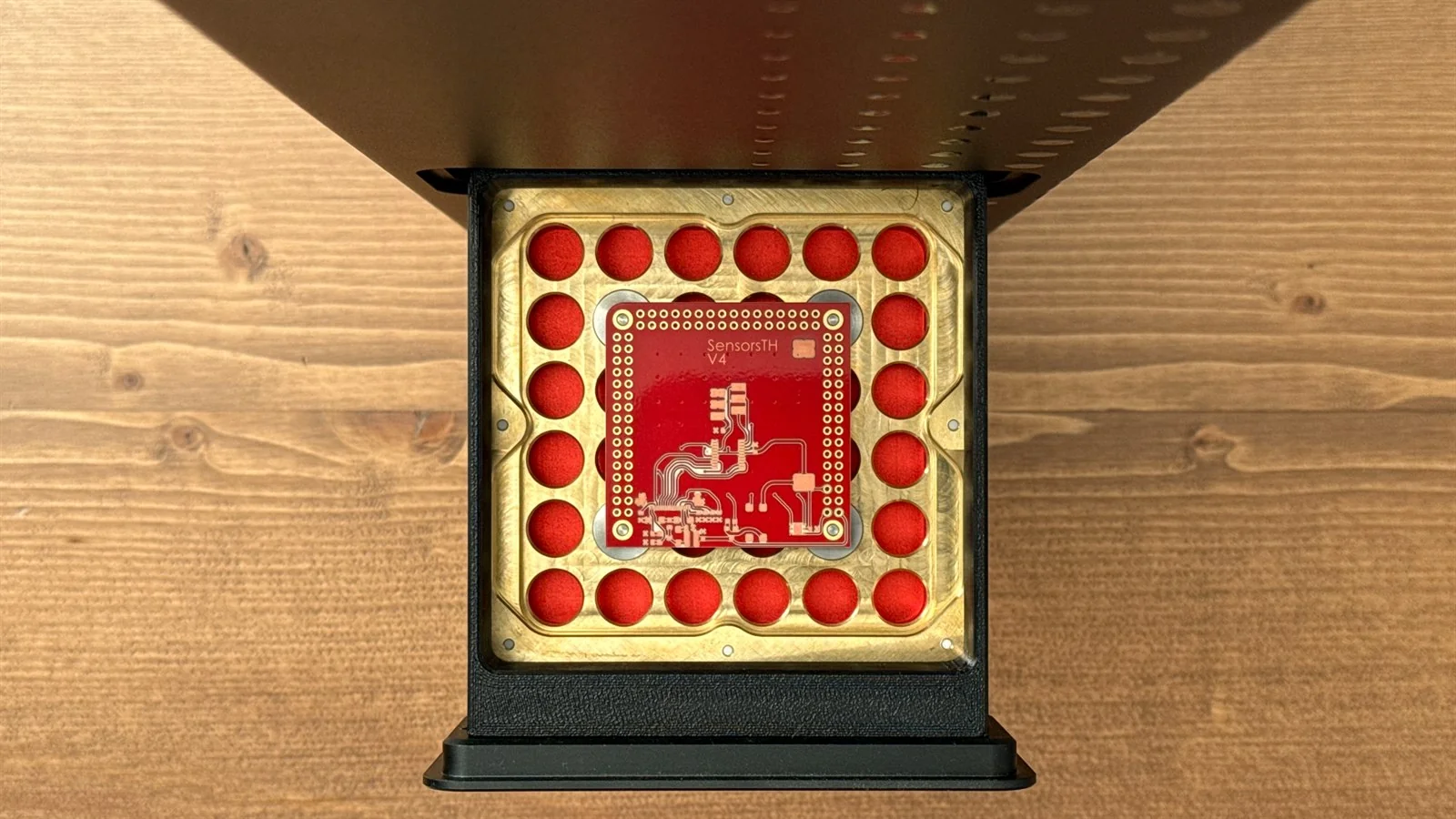 A processed PCB on the PewCB One mounting platform